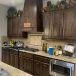 Kitchen featuring custom cabinetry, granite countertops, and modern appliances, showcasing The Perfect Cabinet's remodeling services.