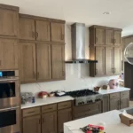 Modern kitchen featuring custom cabinetry, stainless steel appliances, and a sleek countertop design, showcasing The Perfect Cabinet Company's remodeling expertise.