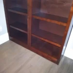 Wooden cabinet with open shelves, showcasing craftsmanship for office cabinetry solutions.