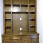Wooden cabinetry with open shelves and drawers, showcasing custom office storage solutions by The Perfect Cabinet.