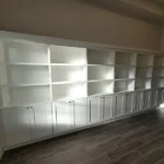 Modern white cabinetry with open shelves and closed storage, showcasing craftsmanship for office remodeling by The Perfect Cabinet.