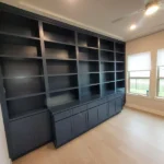 Modern office cabinetry with dark shelving and storage units, showcasing craftsmanship by The Perfect Cabinet.