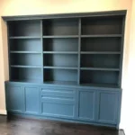 Custom blue cabinetry with open shelves and closed storage, showcasing design options for office spaces by The Perfect Cabinet.